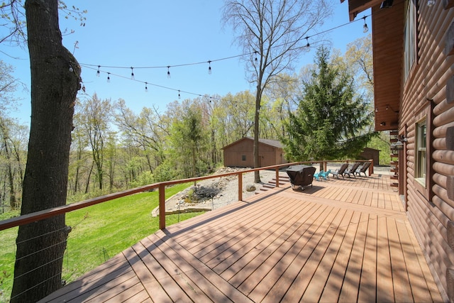 3380 Norvell Rd, Grass Lake, MI 49240 - deck with an outbuilding, a yard, and a shed