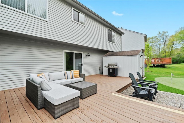 2694 Driftwood Dr, Waterford, MI 48329 - wooden deck featuring a putting area, outdoor lounge area, area for grilling, a lawn, and a storage shed