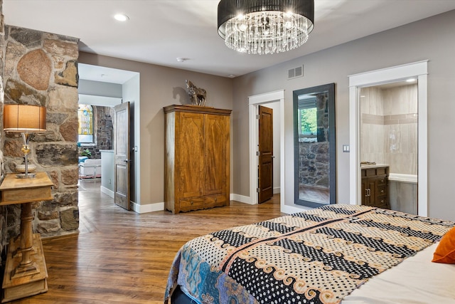 229 E Commerce St Unit 1, Milford, MI 48381 - bedroom featuring wood finished floors, baseboards, a chandelier, and recessed lighting