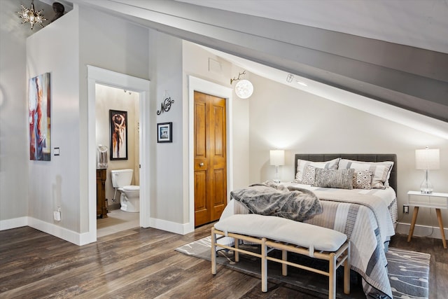 229 E Commerce St Unit 1, Milford, MI 48381 - bedroom with wood finished floors, vaulted ceiling, baseboards, a chandelier, and ensuite bath
