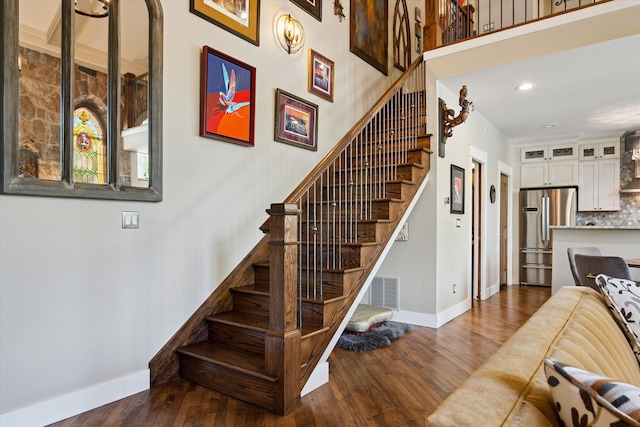 229 E Commerce St Unit 1, Milford, MI 48381 - stairs with baseboards, wood finished floors, and recessed lighting