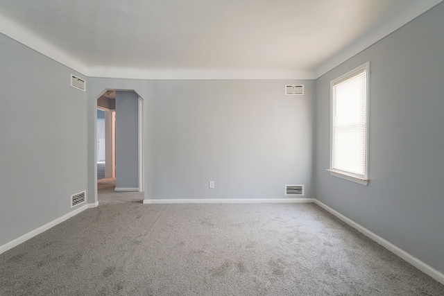 4226 Cadillac Ave, Wayne, MI 48184 - spare room with carpet, arched walkways, and baseboards