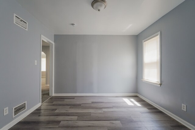 4226 Cadillac Ave, Wayne, MI 48184 - spare room featuring healthy amount of natural light, wood finished floors, and baseboards