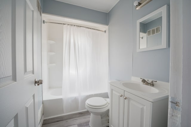 4226 Cadillac Ave, Wayne, MI 48184 - bathroom with toilet, vanity, wood finished floors, and shower / bath combo with shower curtain