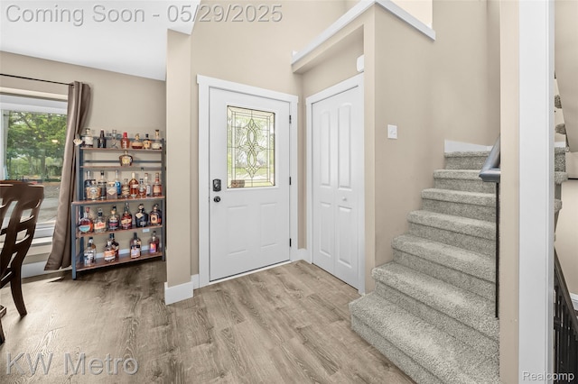 70276 N Main St, Richmond, MI 48062 - entryway featuring stairway, wood finished floors, and baseboards