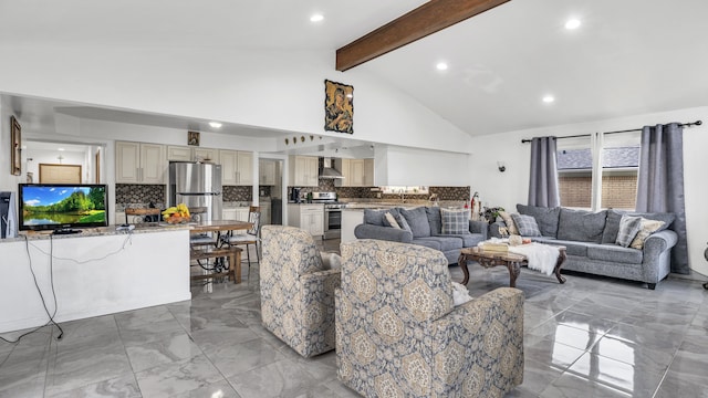 living area featuring light marble finish flooring and recessed lighting