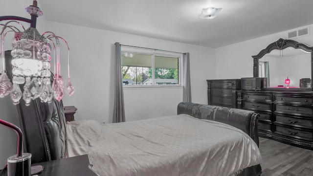bedroom with wood finished floors