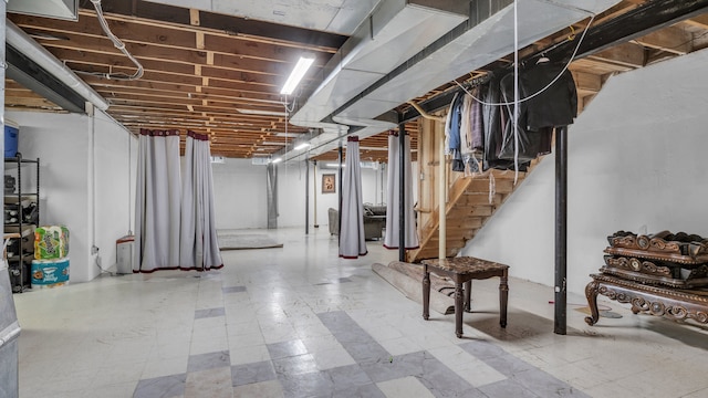 unfinished basement featuring stairway