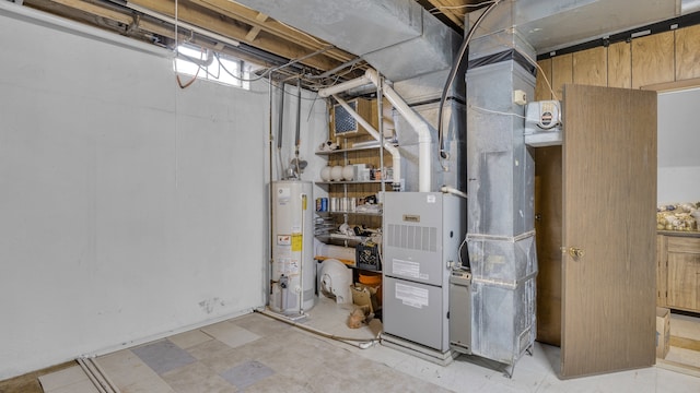 utility room featuring water heater and heating unit