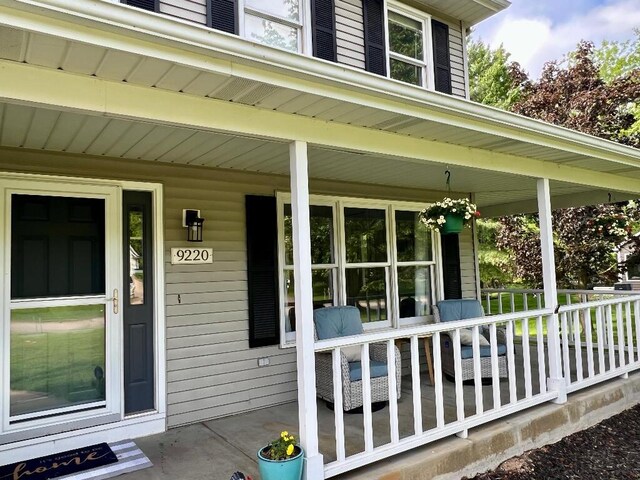 9220 Cotters Ridge Rd, Richland, MI 49083 - property entrance featuring covered porch