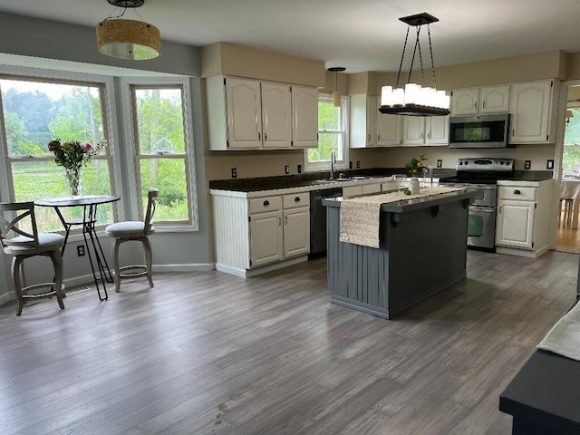 9220 Cotters Ridge Rd, Richland, MI 49083 - kitchen featuring appliances with stainless steel finishes, a sink, and white cabinets