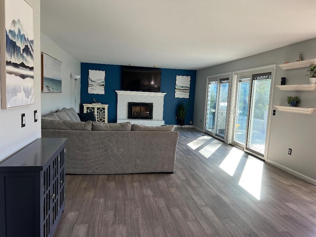 9220 Cotters Ridge Rd, Richland, MI 49083 - living room with dark wood-type flooring, baseboards, and a brick fireplace