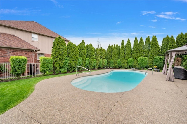 swimming pool featuring a gazebo, a patio area, and a diving board