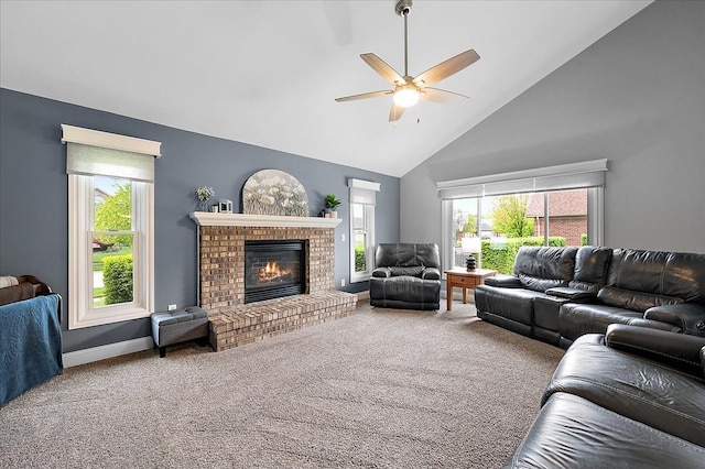 carpeted living area with high vaulted ceiling, a ceiling fan, a fireplace, and baseboards