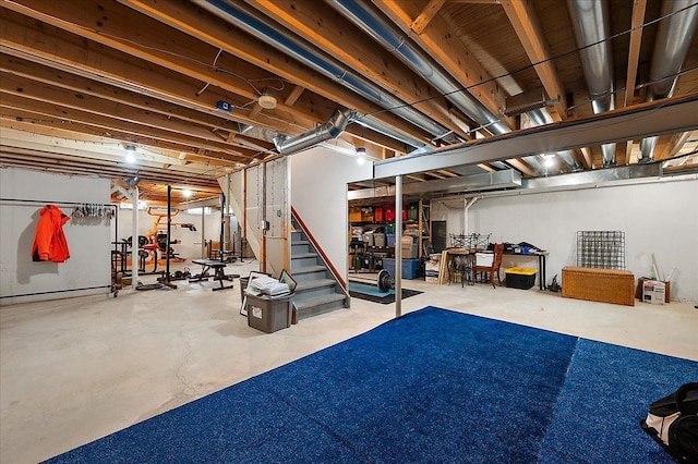unfinished basement featuring stairway
