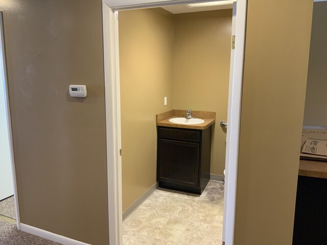 103 W Michigan Ave, Clinton, MI 49236 - bathroom featuring vanity and baseboards