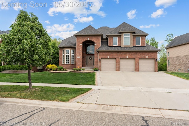 24516 Cavendish Ave E, Novi, MI 48375 - view of front of home with driveway, brick siding, a front yard, a garage, and a shingled roof