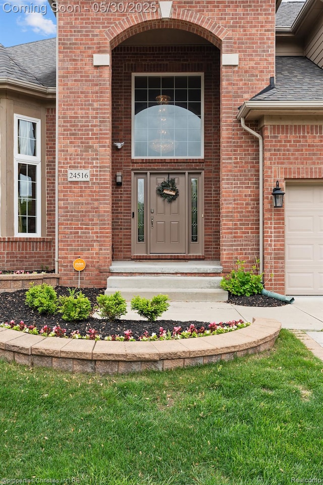 24516 Cavendish Ave E, Novi, MI 48375 - doorway to property with roof with shingles and brick siding