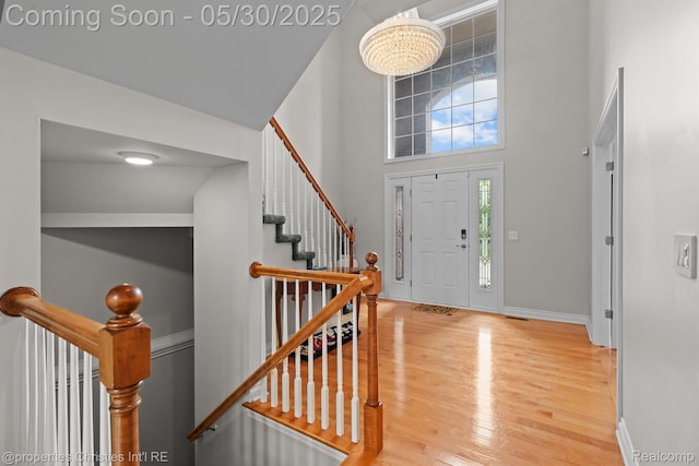 24516 Cavendish Ave E, Novi, MI 48375 - foyer featuring wood finished floors, baseboards, and a towering ceiling