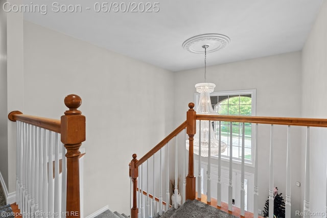 24516 Cavendish Ave E, Novi, MI 48375 - stairway with a chandelier