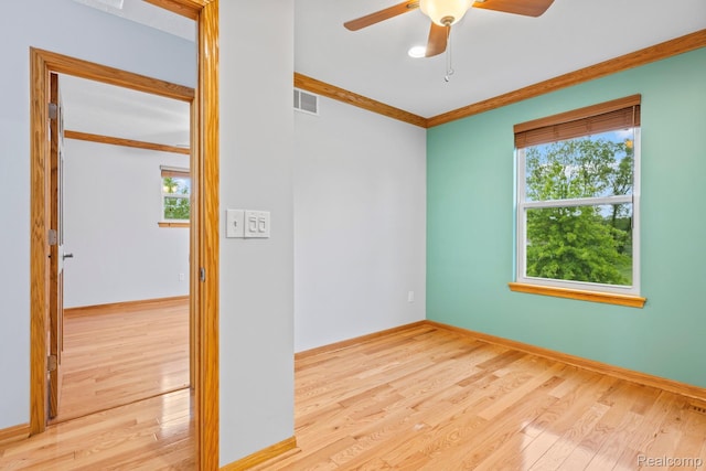 367 116th Ave, Martin, MI 49070 - unfurnished room with wood finished floors, healthy amount of natural light, a ceiling fan, and ornamental molding
