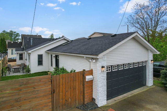 22432 Maple St, Saint Clair Shores, MI 48081 - view of front of house featuring roof with shingles, fence, an attached garage, and a gate