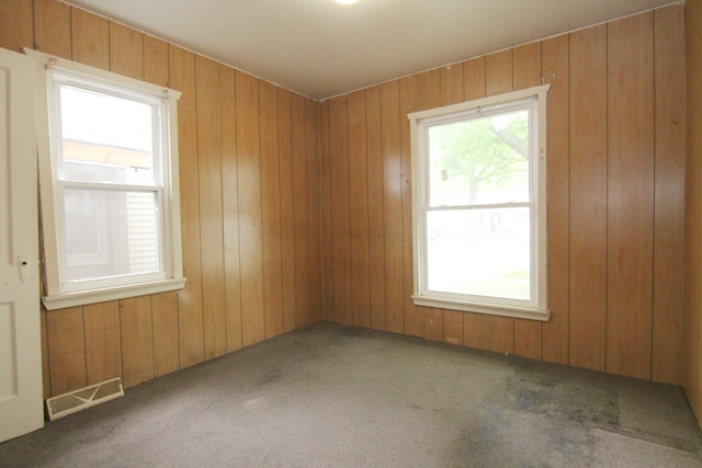 4521 Columbus St, Wayne, MI 48184 - unfurnished room featuring carpet floors and wood walls