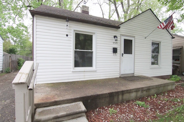 4521 Columbus St, Wayne, MI 48184 - rear view of property with a chimney and fence