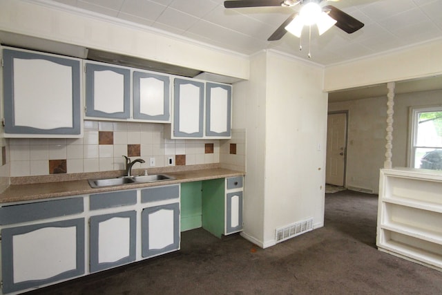 4521 Columbus St, Wayne, MI 48184 - kitchen with a sink, decorative backsplash, dark colored carpet, ornamental molding, and ceiling fan