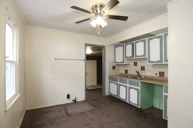 4521 Columbus St, Wayne, MI 48184 - kitchen with a sink, ceiling fan, ornamental molding, backsplash, and dark colored carpet