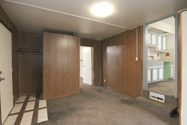 4521 Columbus St, Wayne, MI 48184 - unfurnished bedroom with a closet, wooden walls, and light carpet