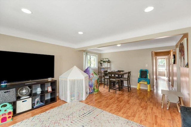 game room with wood finished floors, baseboards, and recessed lighting