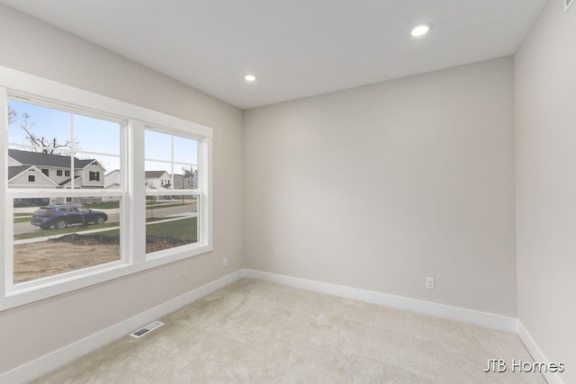 1404 Kimber Dr Unit 124, Lowell, MI 49331 - unfurnished room featuring light colored carpet and recessed lighting