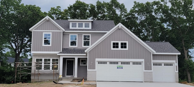 1404 Kimber Dr Unit 124, Lowell, MI 49331 - craftsman inspired home featuring roof with shingles, concrete driveway, and an attached garage