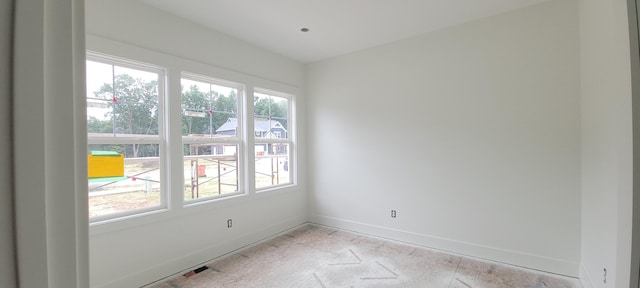 1404 Kimber Dr Unit 124, Lowell, MI 49331 - spare room with baseboards
