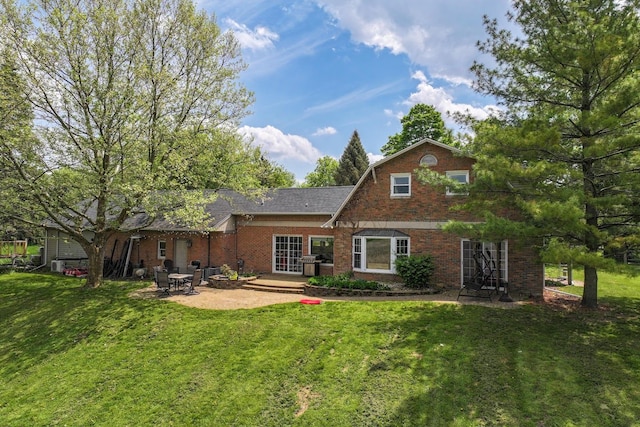 8277 Mccandlish Rd, Grand Blanc, MI 48439 - rear view of house with a patio area, a yard, and brick siding