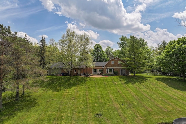 8277 Mccandlish Rd, Grand Blanc, MI 48439 - view of front of house featuring a front yard and brick siding