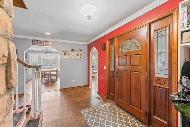 8277 Mccandlish Rd, Grand Blanc, MI 48439 - foyer with arched walkways, a chandelier, ornamental molding, and baseboards