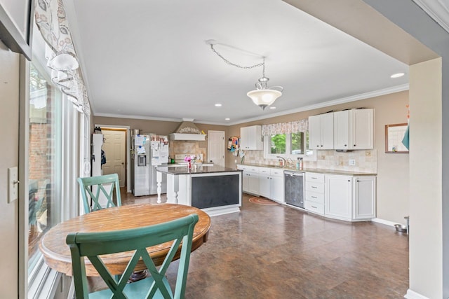 8277 Mccandlish Rd, Grand Blanc, MI 48439 - dining space featuring crown molding, recessed lighting, and baseboards