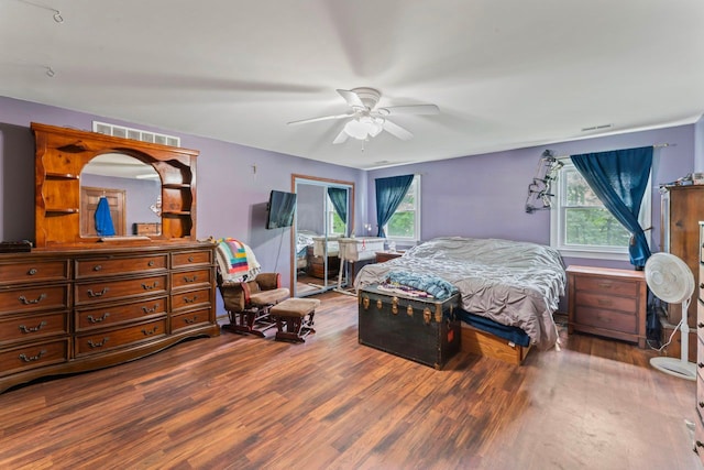 8277 Mccandlish Rd, Grand Blanc, MI 48439 - bedroom featuring multiple windows, wood finished floors, and ceiling fan