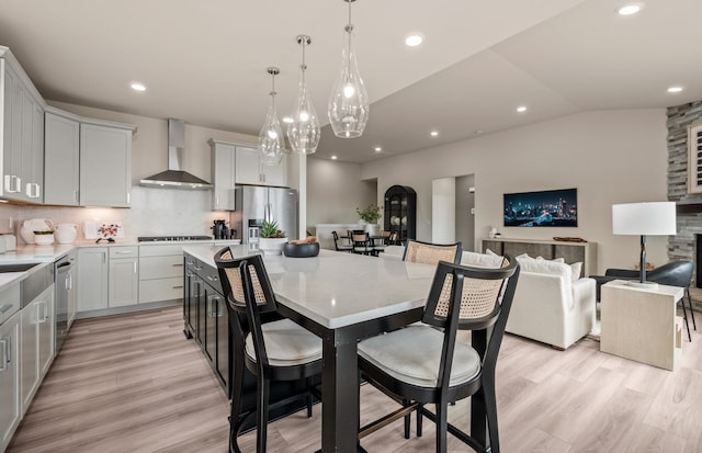 3048 Sheffield Cir, Clarkston, MI 48346 - dining space featuring light wood finished floors, vaulted ceiling, a chandelier, and recessed lighting