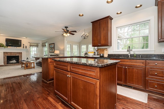 kitchen with open floor plan, dark wood-style flooring, healthy amount of natural light, and recessed lighting