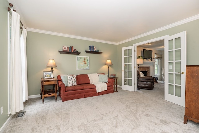 living room with french doors, crown molding, carpet floors, and baseboards