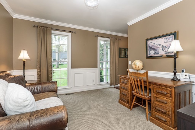 home office featuring ornamental molding, carpet flooring, wainscoting, and a decorative wall