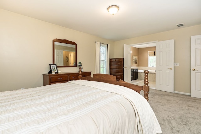 carpeted bedroom with multiple windows and baseboards