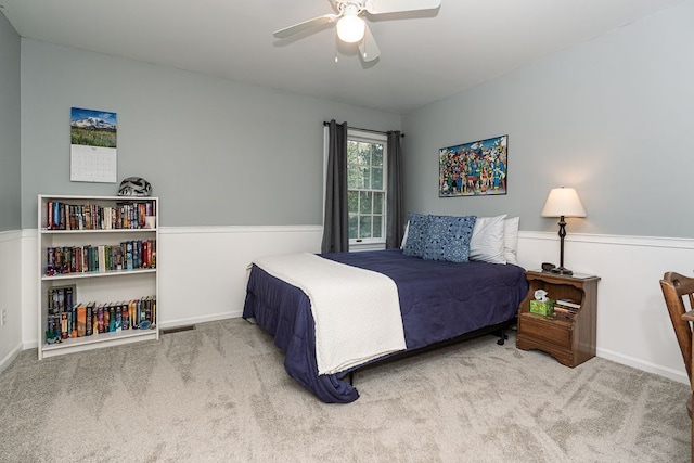 bedroom with carpet, ceiling fan, and baseboards
