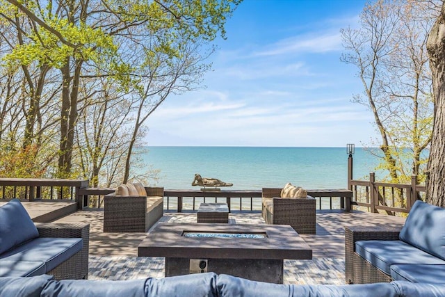 47130 Blue Star Hwy, Covert, MI 49043 - deck with an outdoor living space with a fire pit and a water view