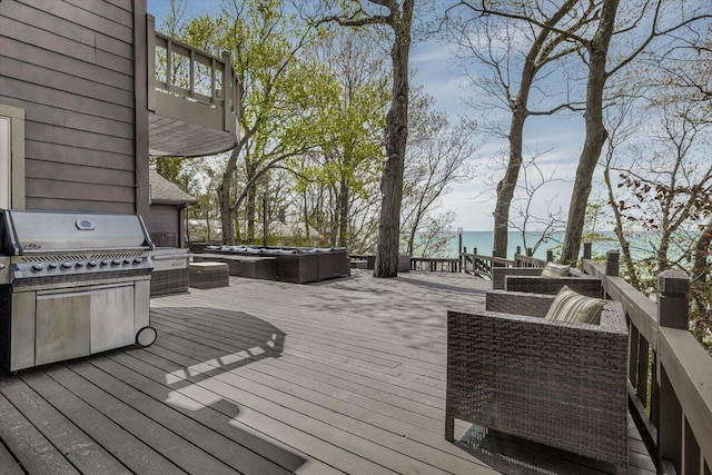 47130 Blue Star Hwy, Covert, MI 49043 - wooden terrace with an outdoor hot tub, a water view, and area for grilling