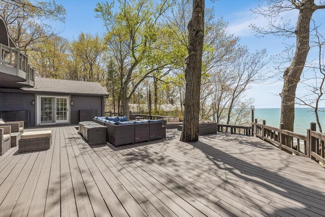 47130 Blue Star Hwy, Covert, MI 49043 - deck featuring an outdoor living space, a water view, and a garage