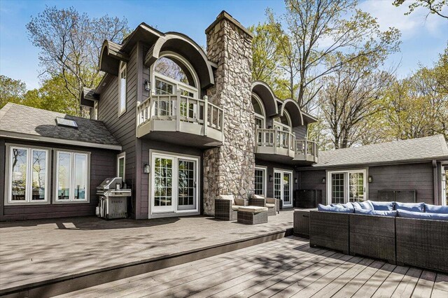 47130 Blue Star Hwy, Covert, MI 49043 - rear view of property with outdoor lounge area, a balcony, a deck, and a chimney